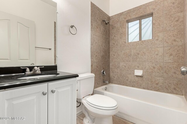 full bathroom featuring tub / shower combination, toilet, and vanity