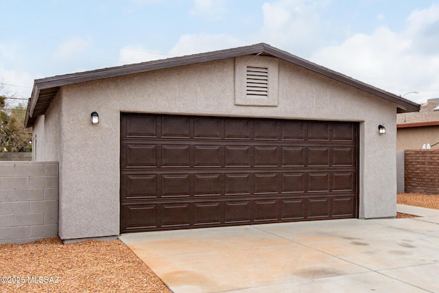 garage with fence