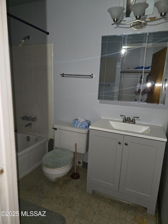 bathroom featuring shower / bathing tub combination, vanity, and toilet