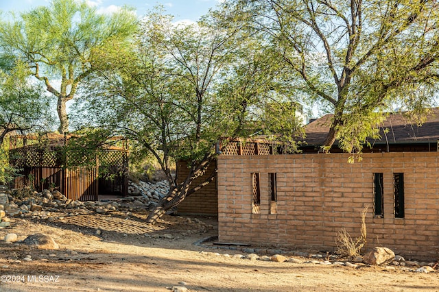 view of yard with fence and stairs