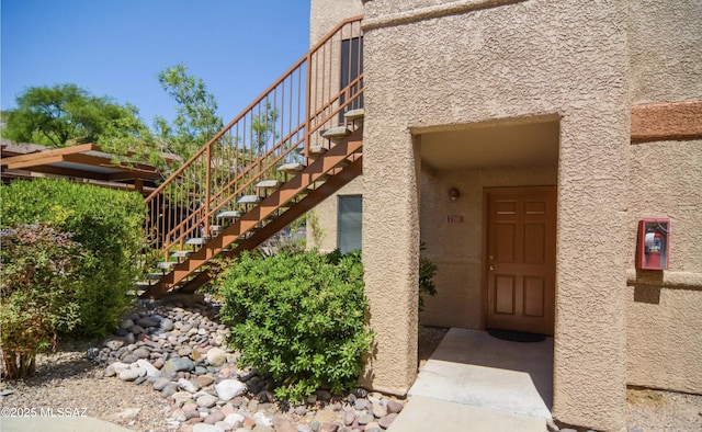 doorway to property with stucco siding