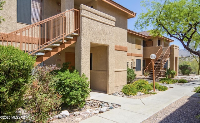 view of property featuring stairway