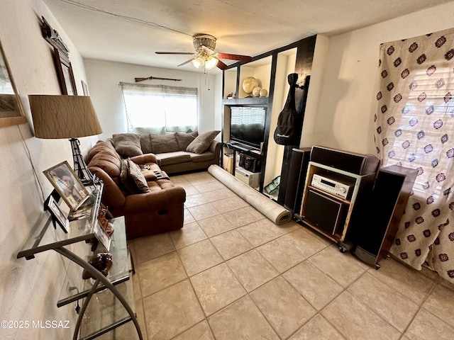 living room featuring light tile patterned floors and a ceiling fan