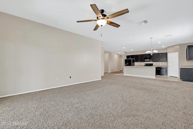 unfurnished living room featuring light carpet, visible vents, baseboards, ceiling fan with notable chandelier, and recessed lighting