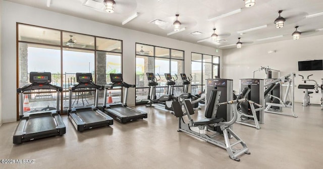 workout area featuring a ceiling fan and visible vents