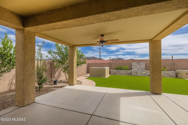 view of patio / terrace featuring a fenced backyard and a ceiling fan