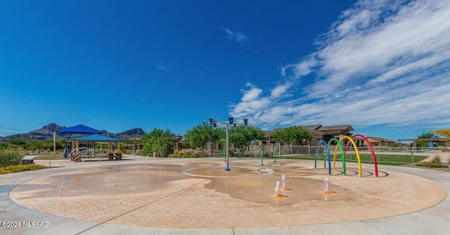 community playground with a gazebo and fence