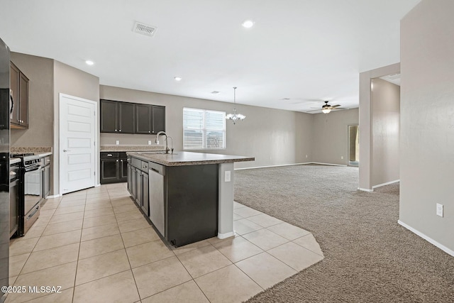 kitchen with light colored carpet, ceiling fan with notable chandelier, electric range, visible vents, and open floor plan