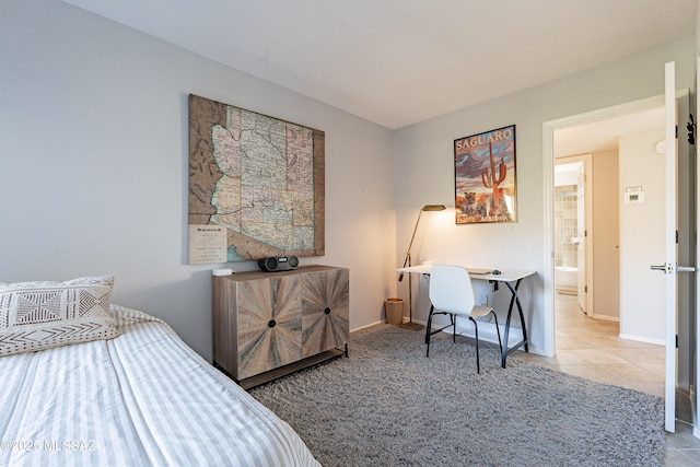 bedroom featuring baseboards, carpet floors, and tile patterned flooring