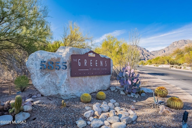 community sign featuring a mountain view