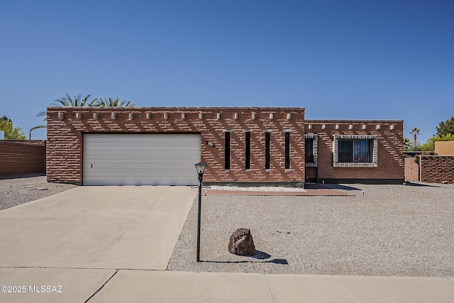 view of front of home featuring an attached garage and concrete driveway