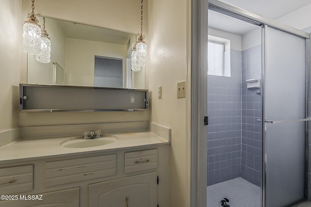 bathroom with vanity and a stall shower