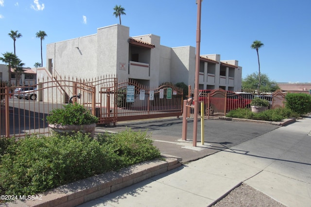 view of property with fence