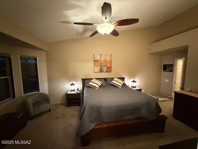 bedroom with lofted ceiling, carpet floors, and ceiling fan