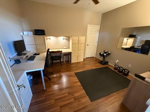 office space with a ceiling fan and wood finished floors