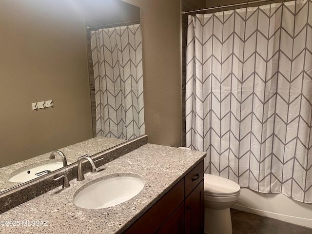 bathroom with toilet and vanity