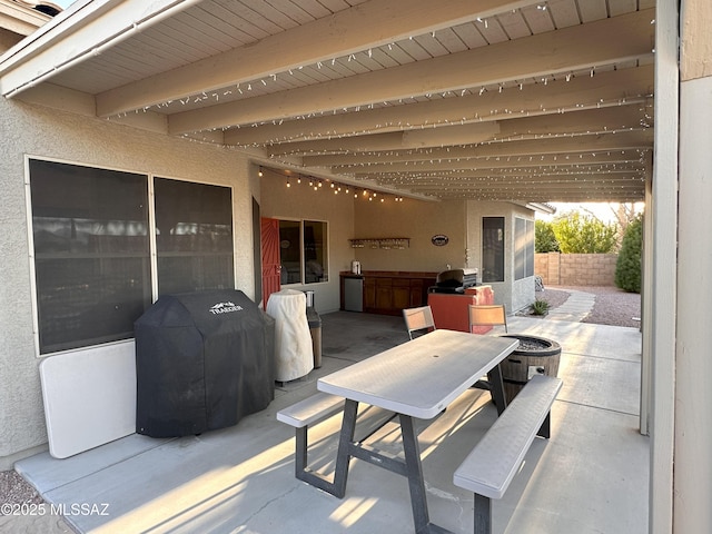 view of patio / terrace featuring outdoor dining space and a grill