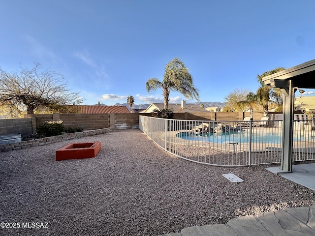 view of yard with a fenced in pool and a fenced backyard