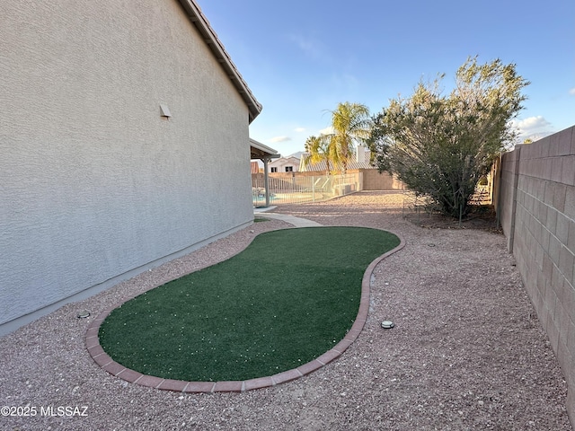 view of yard with a fenced backyard