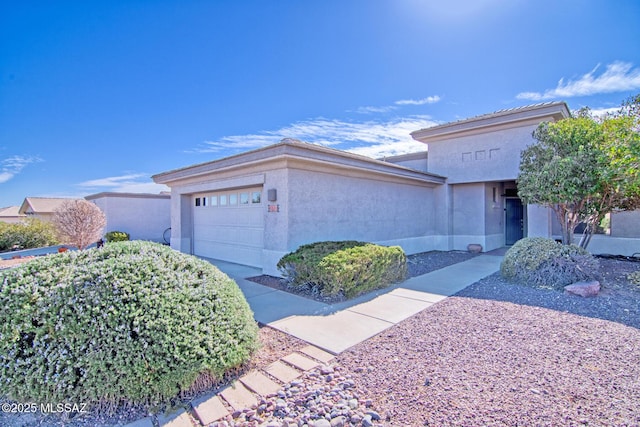 4621 S Pinnacle Peak Dr, Green Valley, AZ 85622 - view of front of property featuring an attached garage and stucco siding
