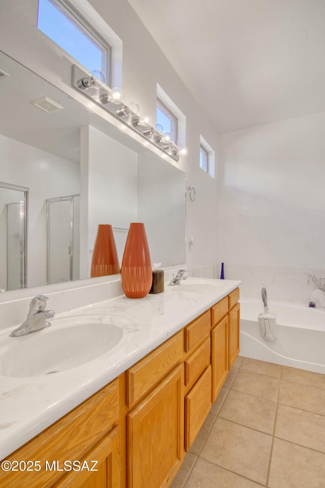 4621 S Pinnacle Peak Dr, Green Valley, AZ 85622 - full bathroom with tile patterned flooring, double vanity, a stall shower, and a bath