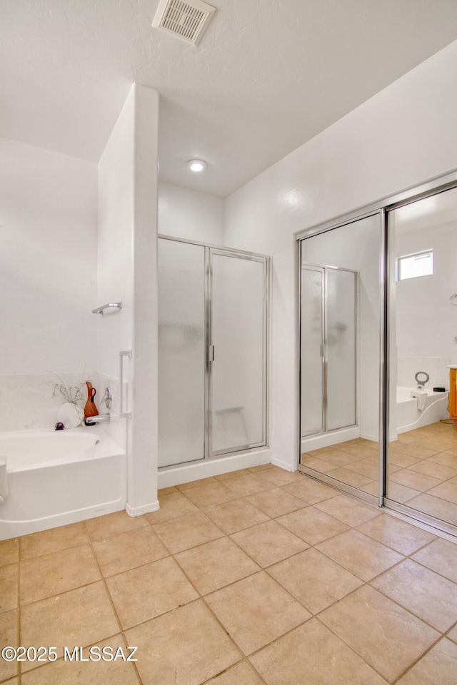 4621 S Pinnacle Peak Dr, Green Valley, AZ 85622 - full bath with tile patterned flooring, a bath, and a stall shower