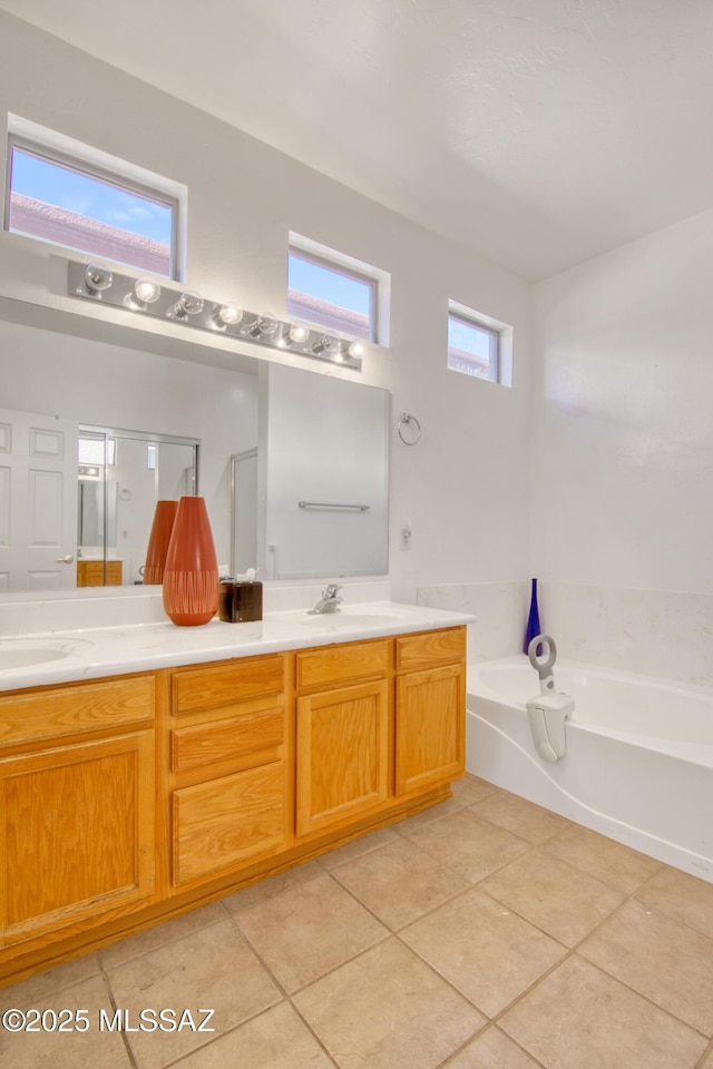 4621 S Pinnacle Peak Dr, Green Valley, AZ 85622 - bathroom with tile patterned floors, double vanity, a bath, and an enclosed shower