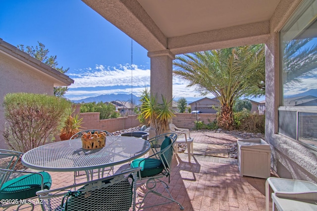 4621 S Pinnacle Peak Dr, Green Valley, AZ 85622 - view of patio featuring outdoor dining area, a fenced backyard, and a mountain view