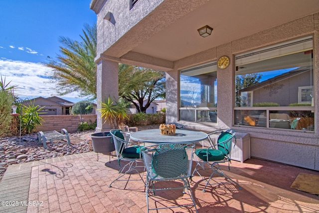 4621 S Pinnacle Peak Dr, Green Valley, AZ 85622 - view of patio featuring fence and outdoor dining area