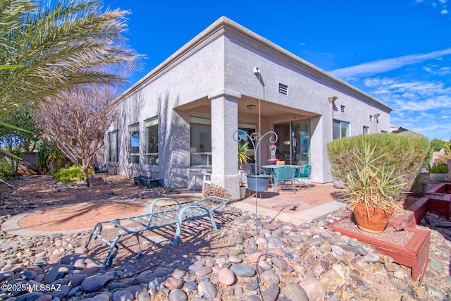 4621 S Pinnacle Peak Dr, Green Valley, AZ 85622 - back of house with a patio and stucco siding