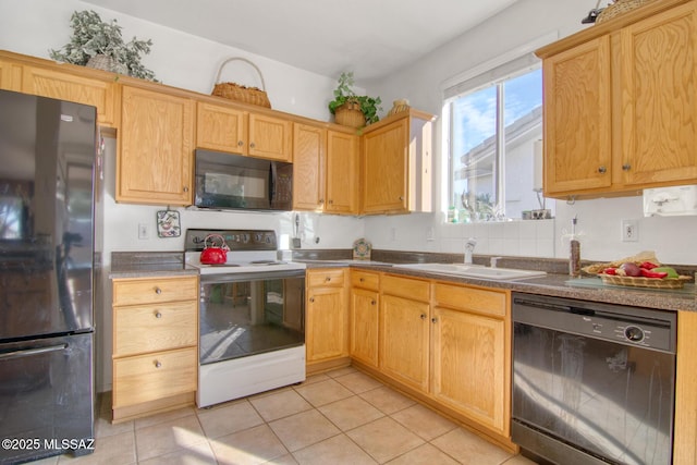 4621 S Pinnacle Peak Dr, Green Valley, AZ 85622 - kitchen featuring black appliances, a sink, and light tile patterned floors