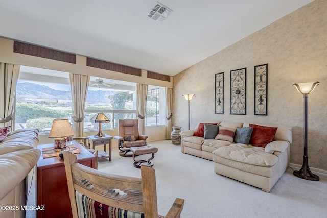 living room featuring visible vents, baseboards, vaulted ceiling, carpet floors, and a mountain view