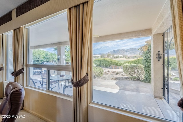 doorway to outside with a mountain view