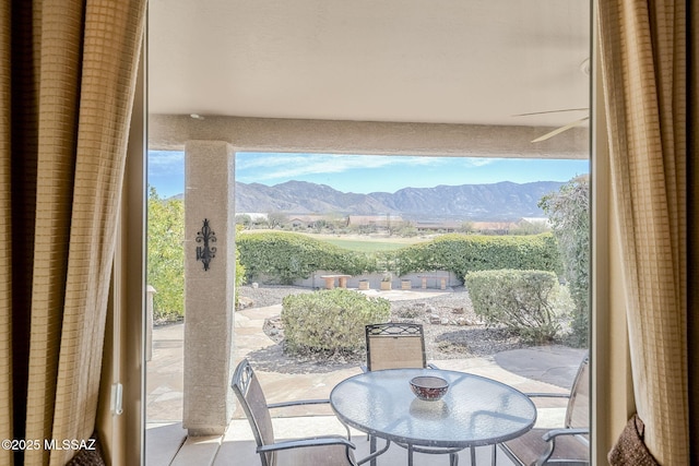 interior space featuring a mountain view and outdoor dining space