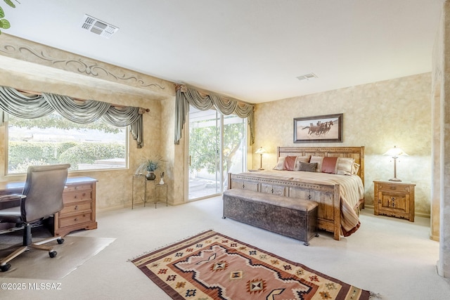 bedroom featuring visible vents, carpet flooring, wallpapered walls, and access to outside