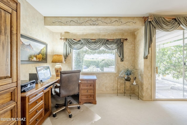 office with baseboards and light carpet