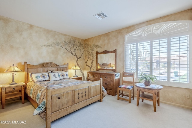 bedroom featuring baseboards, visible vents, and carpet floors