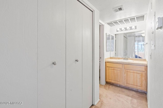 bathroom with visible vents and vanity