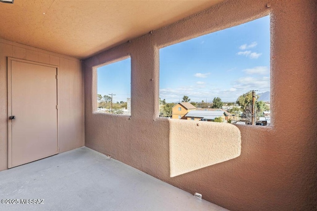 view of patio featuring a balcony