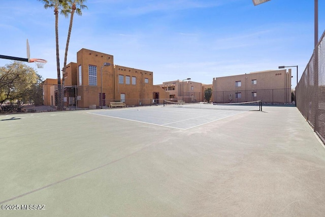 view of sport court featuring fence