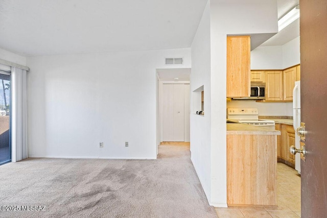 kitchen featuring light carpet, white appliances, visible vents, light countertops, and light brown cabinetry