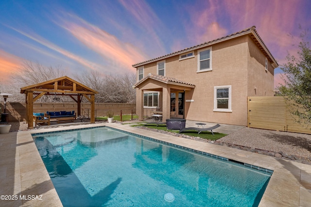 view of pool with a patio area, a fenced backyard, a gazebo, and an outdoor hangout area