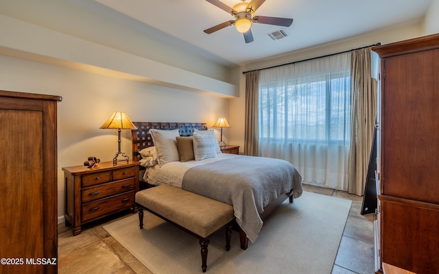 bedroom featuring visible vents and a ceiling fan