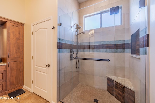 full bathroom with a shower stall