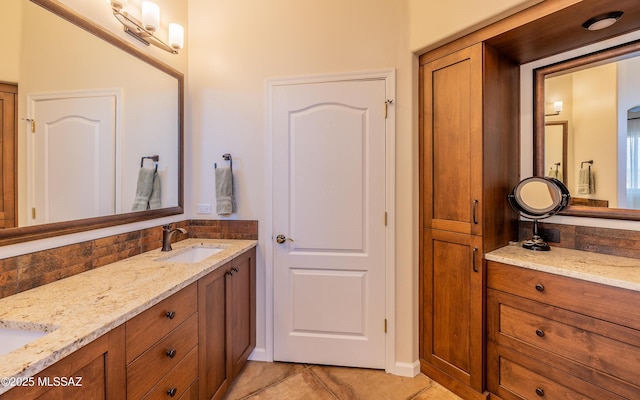 full bathroom featuring vanity, decorative backsplash, and tile patterned flooring