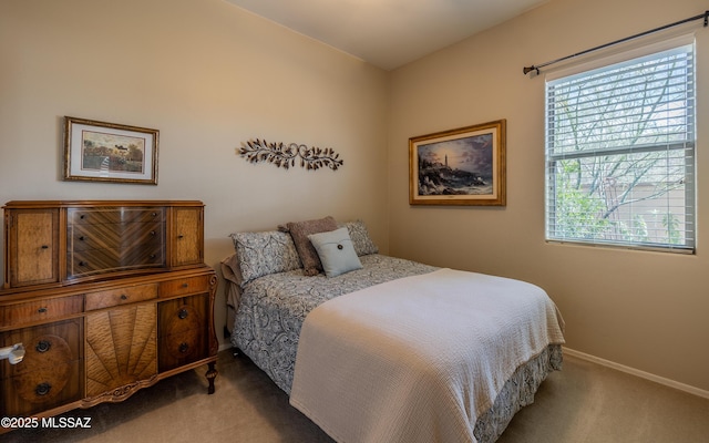 carpeted bedroom with baseboards