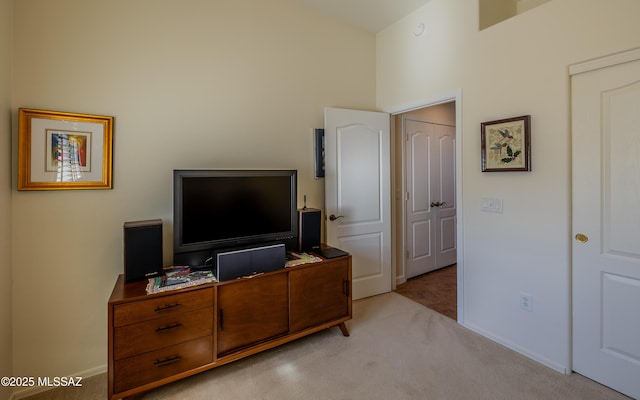 bedroom featuring baseboards and carpet floors