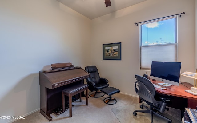 home office featuring a ceiling fan, baseboards, and carpet floors