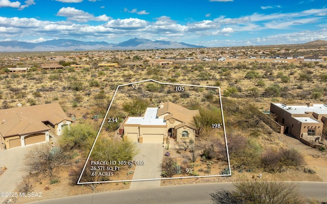 aerial view featuring view of desert and a mountain view