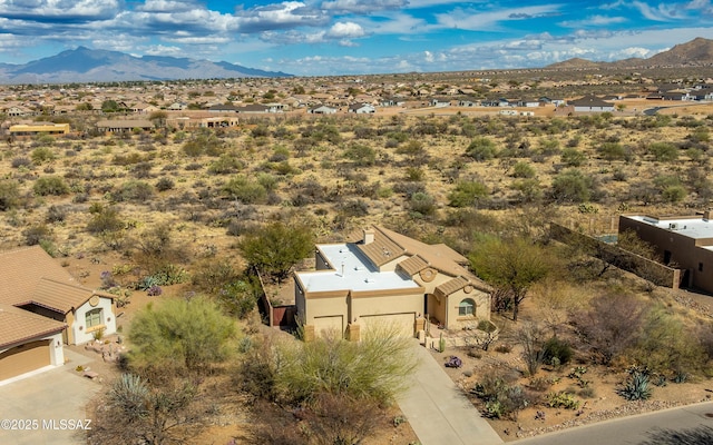 drone / aerial view featuring a mountain view